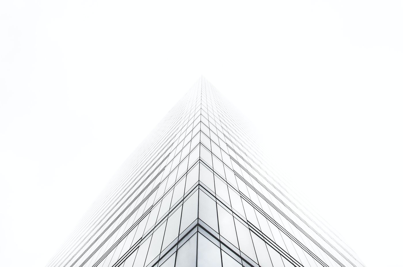 Upward view of a modern glass office tower